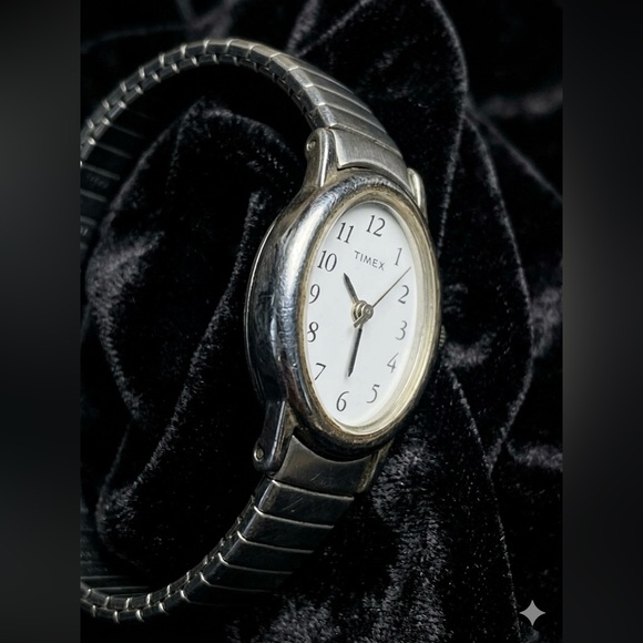 Timex Cavatina Silver Tone Oval Womens Quartz Watch Stretch Band